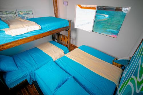 a bedroom with two bunk beds on a boat at Solarium Beach Club in Playa Blanca