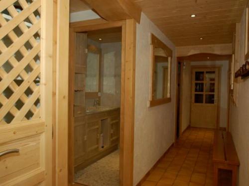 a hallway of a home with a wine cellar at Appartement chalet pour 6 pers., animaux admis, parking - FR-1-467-39 in Le Grand-Bornand