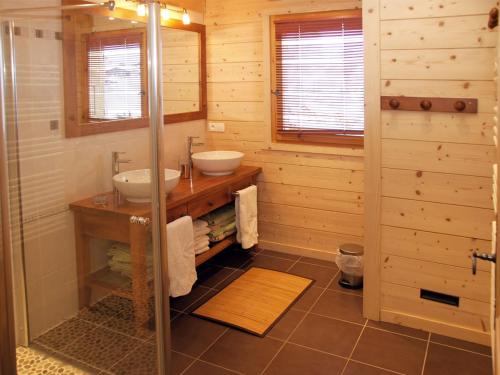 a bathroom with two sinks and a shower at Chalet Le Grand-Bornand, 6 pièces, 12 personnes - FR-1-467-44 in Le Grand-Bornand