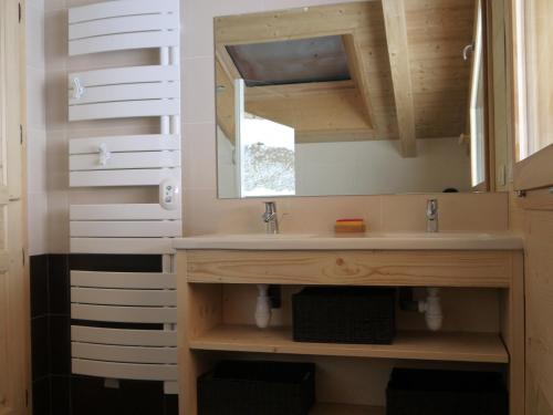 a bathroom with a sink and a mirror at Chalet Le Grand-Bornand, 5 pièces, 10 personnes - FR-1-467-71 in Le Grand-Bornand
