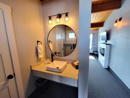 a bathroom with a sink and a mirror at Saltwater Inn in Westport