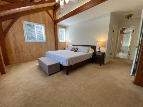 a large bedroom with a bed and a window at Peaceful & secluded, yet close to town. in Mariposa