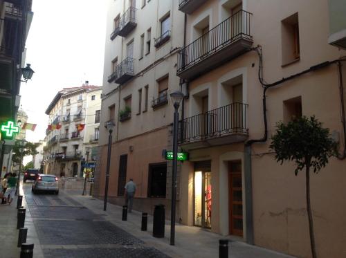 a street in a city with a building at Apartamentos Alcañiz, Blanca in Alcañiz