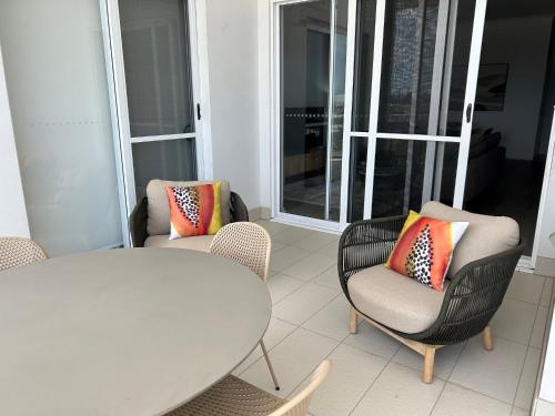 a room with two chairs and a table and a window at Boulevard North Lakes in North Lakes