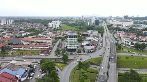 an aerial view of a city with a highway at Roxy Hotel & Apartments in Kuching