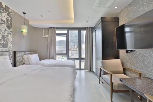 Postel nebo postele na pokoji v ubytování HOTEL YUNA Business