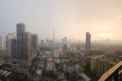 a cityscape of a city with tall buildings at Sentral Suites Kuala lumpur By Leyla 3BR suites 8 pax in Kuala Lumpur