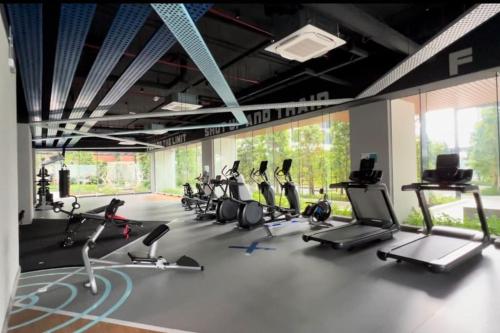 a gym with many cardio bikes and treadmills at Sentral Suites Kuala lumpur By Leyla in Kuala Lumpur
