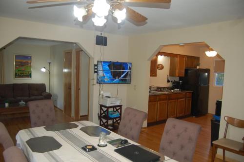 a kitchen and living room with a table and chairs at The Young’s - Northern Indiana in Gary