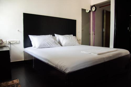 Ένα ή περισσότερα κρεβάτια σε δωμάτιο στο Mama Rose Homestay in Madipakkam