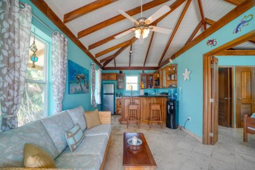 a living room with a couch and a table at Lucky Duck Villa - Private Beach Escape in Maya Beach