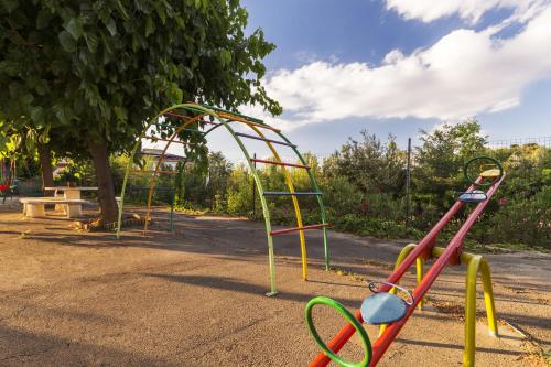 a group of playground equipment in a park at Hotel Sausa in Vilafreser