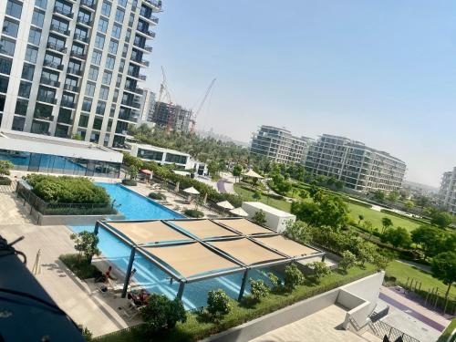 an overhead view of a swimming pool in a city at Luxury cozy private room in Dubai