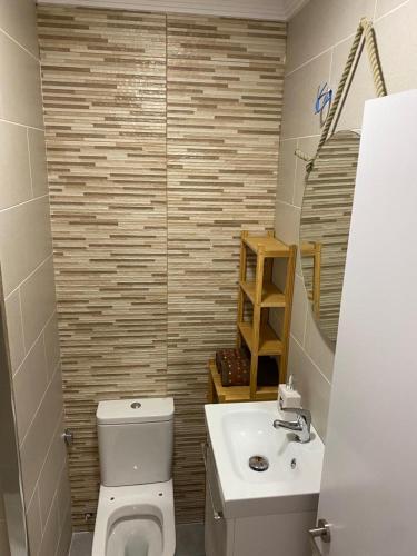 a bathroom with a toilet and a sink at Estudio 86 B in Torrox Costa
