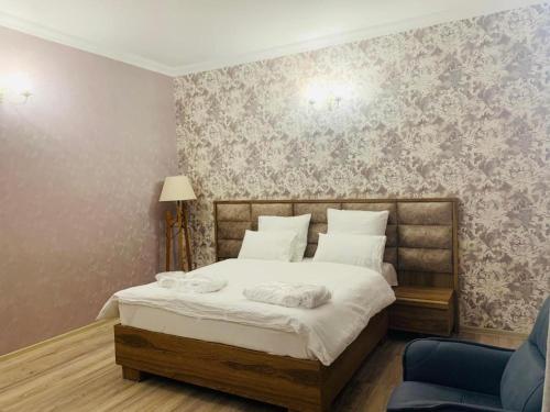 Postel nebo postele na pokoji v ubytování Wald Hotel Lagodekhi Rooms