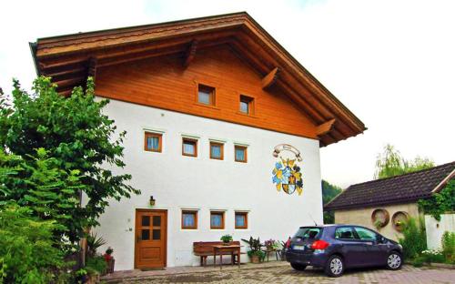 a house with a car parked in front of it at Haus Ploner - Pichlerhof in Chienes