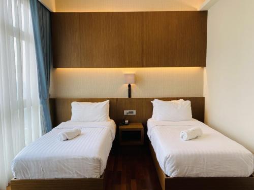 Postel nebo postele na pokoji v ubytování Tribeca Serviced Hotel by Millennium