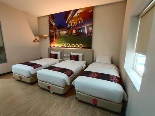 Cama o camas de una habitación en Hotel Promenade Cihampelas