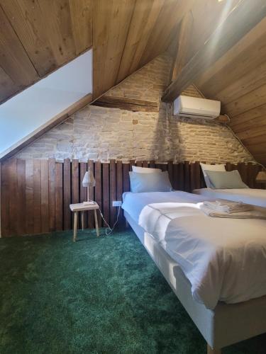 Postel nebo postele na pokoji v ubytování GÎTE LE GEVOT