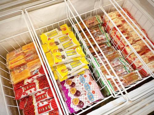 a refrigerator filled with lots of different types of food at Vasty Jiaoxi Hotel in Jiaoxi