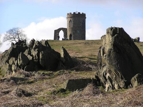 a castle on top of a hill with rocks at The Wine Loft in Quorndon