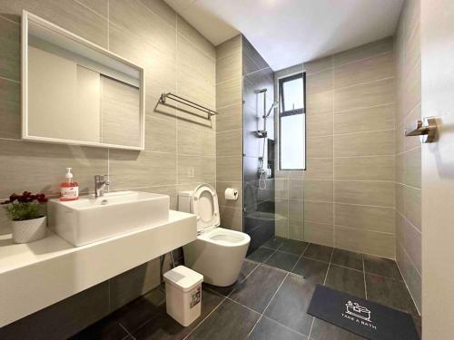a bathroom with a white sink and a toilet at Trion KL 10mins to KLCC-Lalaport-Velocity 6 Pax in Kuala Lumpur
