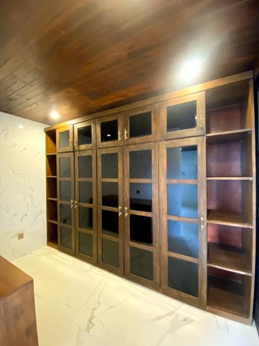 a room with some glass doors in a room at Shankara Munduk Bali in Munduk