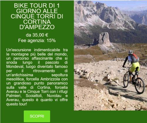 a poster of a person riding a bike on a mountain at B&B Dolomitincanto in Cesiomaggiore
