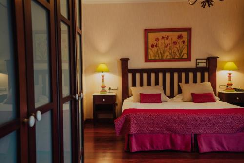 Postel nebo postele na pokoji v ubytování Hotel Spa Villalba