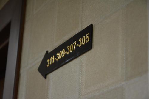 a sign that is on the side of a wall at Lara Hotel and Spa in Baku