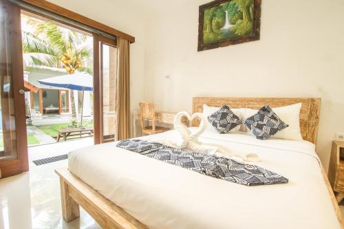 Postel nebo postele na pokoji v ubytování Bali Billy Village