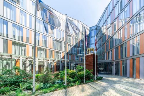 an external view of a building with a courtyard at Rixwell Elefant Hotel in Rīga
