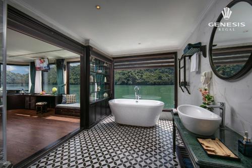 a large bathroom with a tub and a sink at Genesis Luxury Regal Cruises in Ha Long