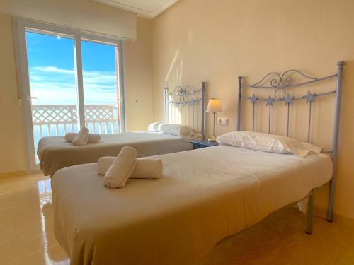 A bed or beds in a room at Spanish Connection - Playa Principe