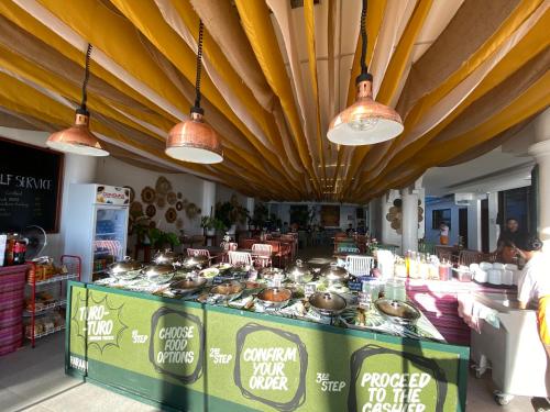 a restaurant with a buffet of food and lights at Boracay Sea View Hotel in Boracay