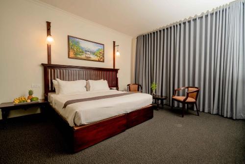 Postel nebo postele na pokoji v ubytování Hotel Nippon Colombo