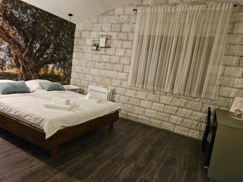Una cama o camas en una habitación de Apartmani Drijen