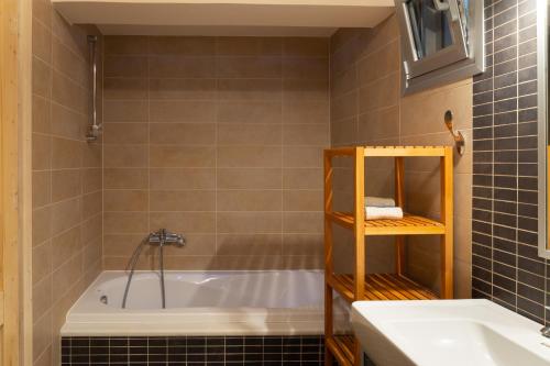 a bathroom with a tub and a sink at Ionian Dream Villas in Lefkada Town
