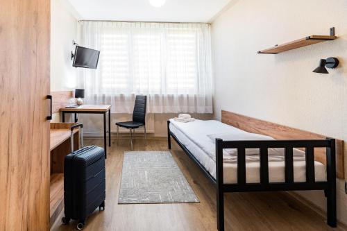 Posteľ alebo postele v izbe v ubytovaní Hotel Alf