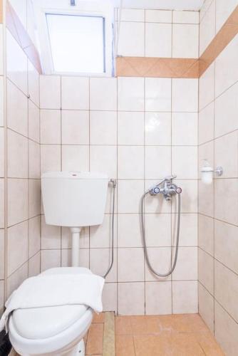 a bathroom with a toilet and a shower at Urban Apt Next University 20 in Heraklio
