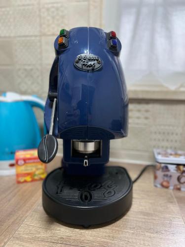 a blue mixer sitting on top of a table at Suite Cavour Luxury Home Taranto in Taranto