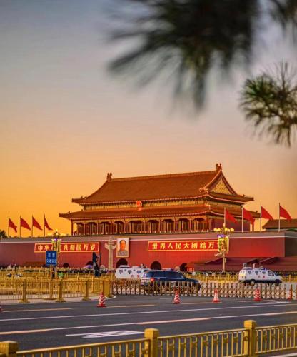 a chinese building with a street in front of it at Beijing Xin xiang YaYuan Countyard Hotel&NearWang Fu Jing Forbidden City Lama Temple and Summer palace,5 minutes walk from subway ,Free Laundry and coffee in Beijing