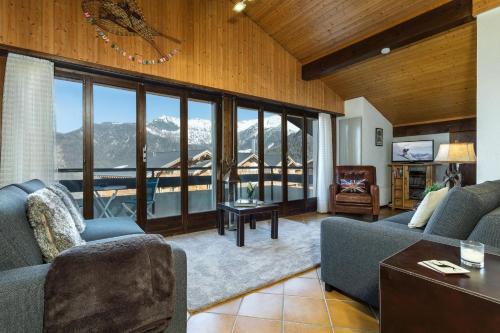 a living room with a view of a mountain at Penthouse 36 Savoleyres in La Tzoumaz