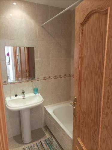 a bathroom with a sink and a bath tub at Ático cala de Mijas in Mijas
