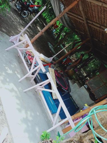 a white ladder sitting next to a pool of water at JUNGLE GYM LA UNION Prana fan kubo 2 pax in Rimus