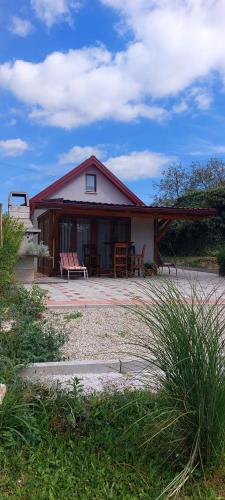 a house with a bench in front of it at Holiday Old stone house in Sveti Ivan Zelina