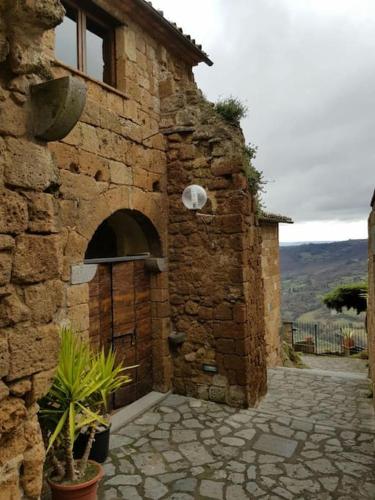 a brick building with an oven in the side of it at il sogno di Civita in Civita di Bagnoregio