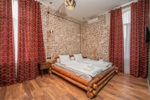 Postel nebo postele na pokoji v ubytování Hotel Piano Kvareli