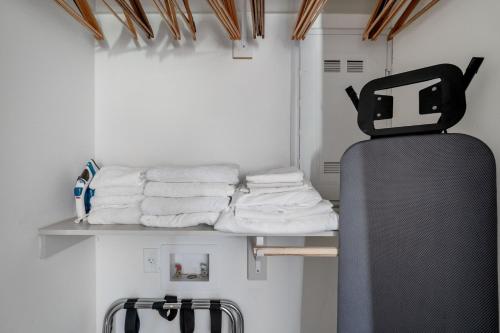 a row of towels on a shelf in a room at Downtown studio w deck gym nr offices ATX-213 in Austin