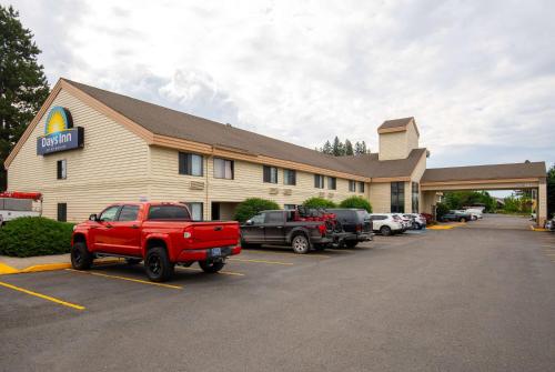 a store with a red truck parked in a parking lot at Days Inn by Wyndham Coeur d'Alene in Coeur d'Alene